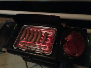 Barbecuing Cumberland sausages