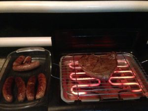 Barbecuing steak of some sort