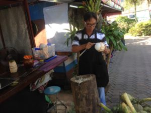 Sob Ruak village - Man removing kernel